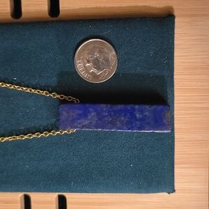Lapis pendant on gold tone chain